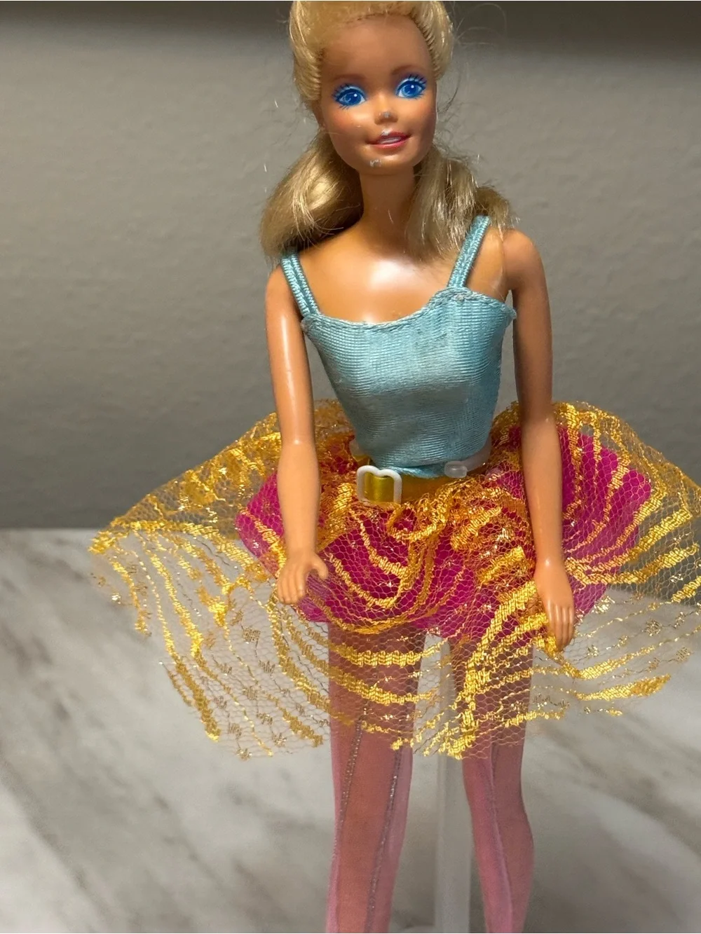 vintage blonde 1998 Bubble Fairy Barbie doll wearing a light blue top and a pink